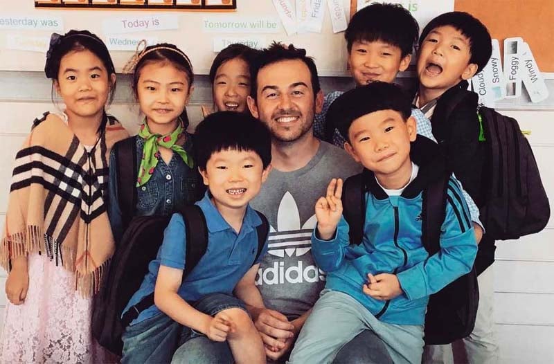An ESL Teacher and his young students in South Korea